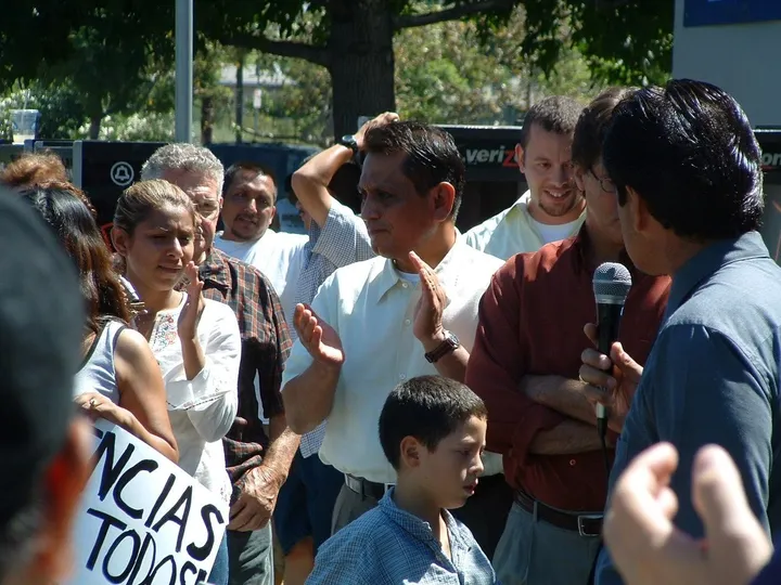 A speaker addressing a crowd of community members